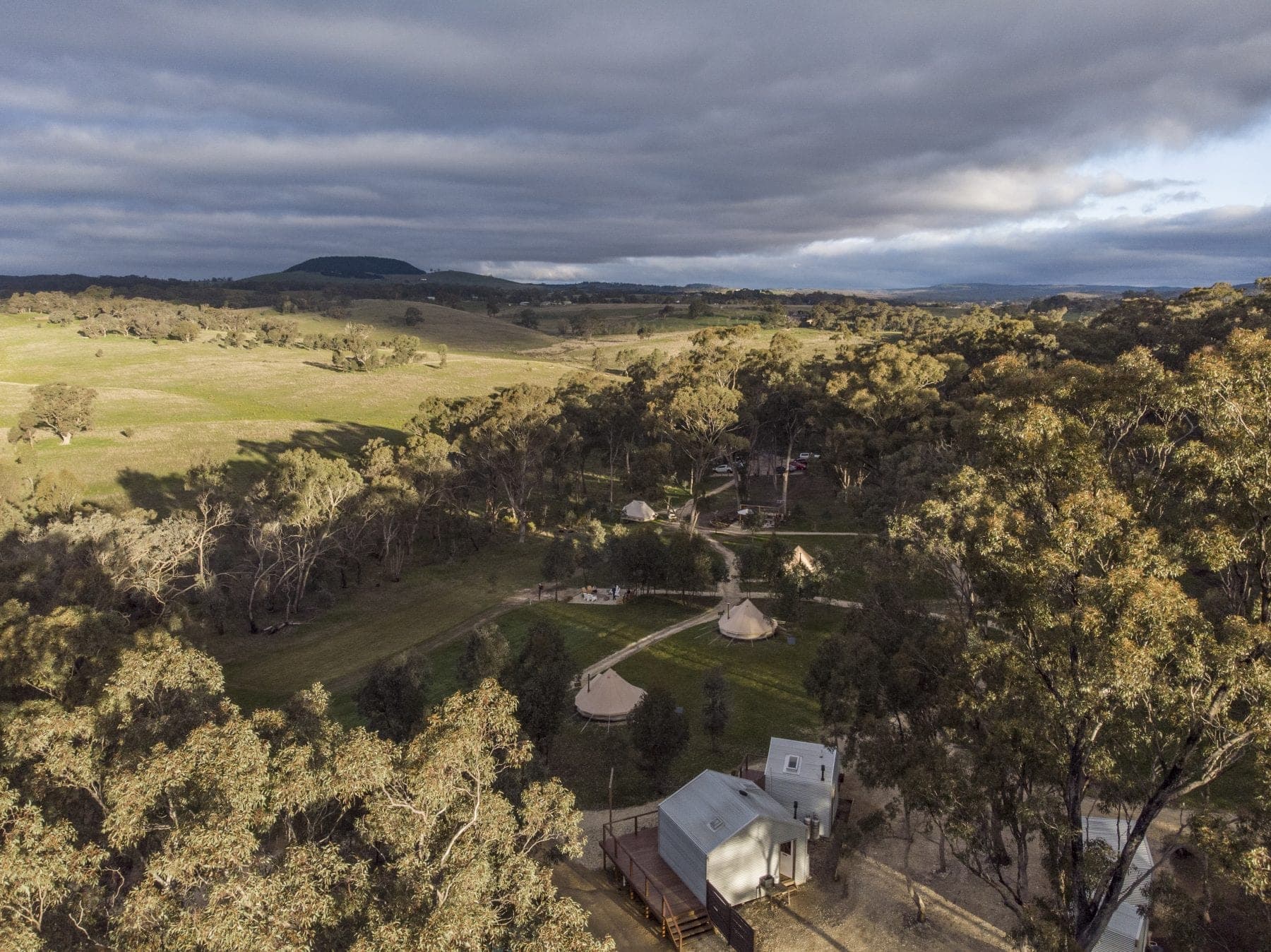 The campsite from the air: the clearing, the dam and the paddocks beyond