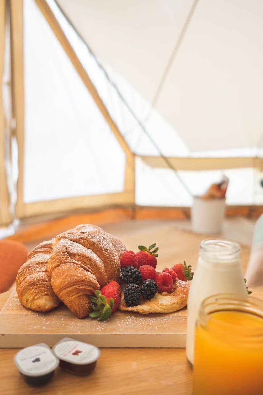 Croissants, strawberries and juice from the Brekkie Box, close up