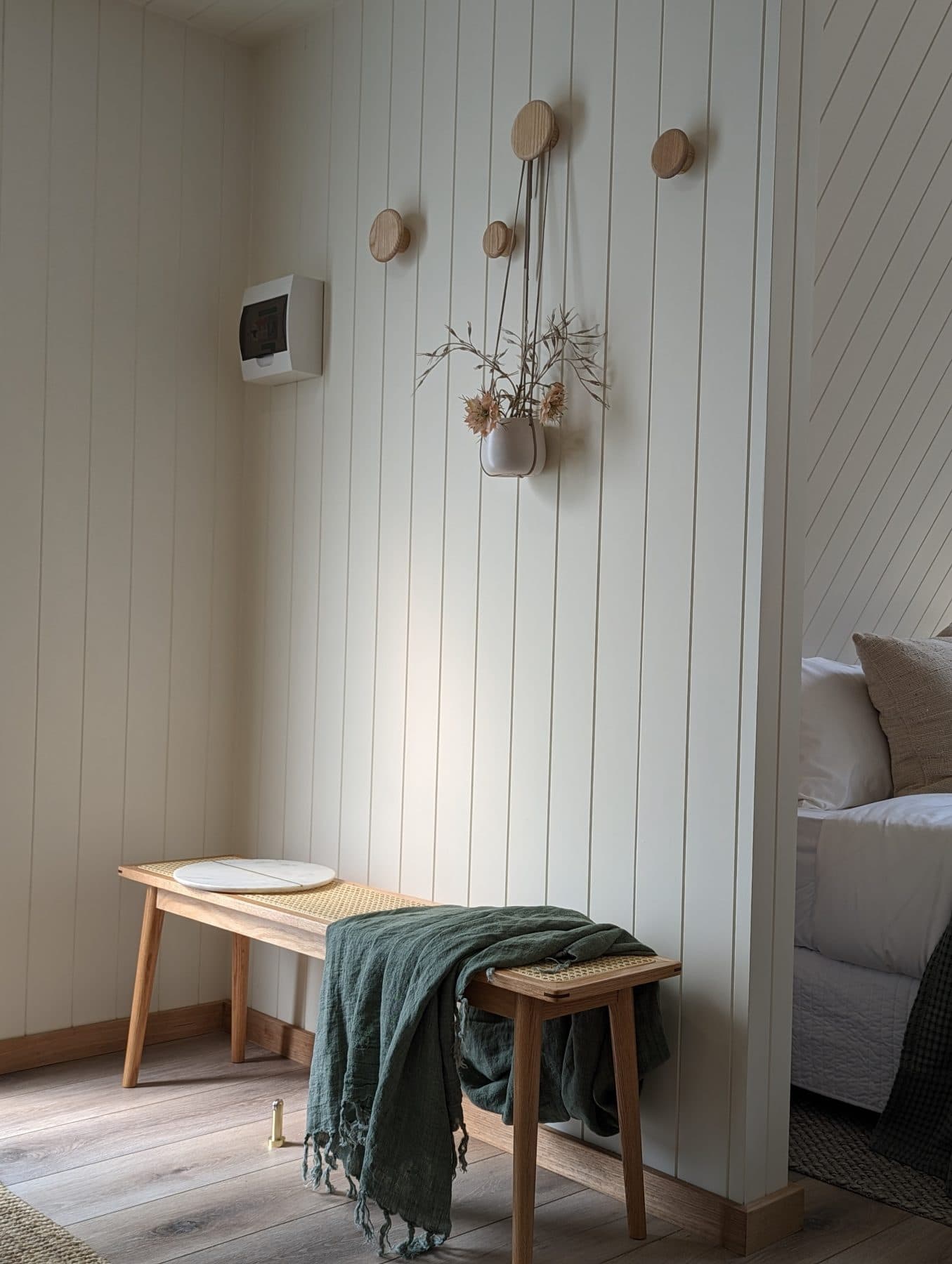 The cabin's white-panelled walls and its ceiling fan