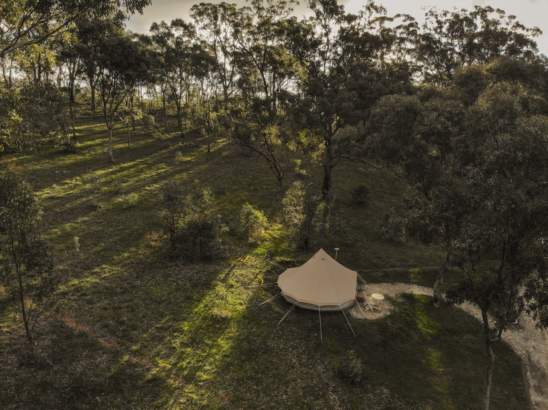 A bell tent from directly above, in the bush