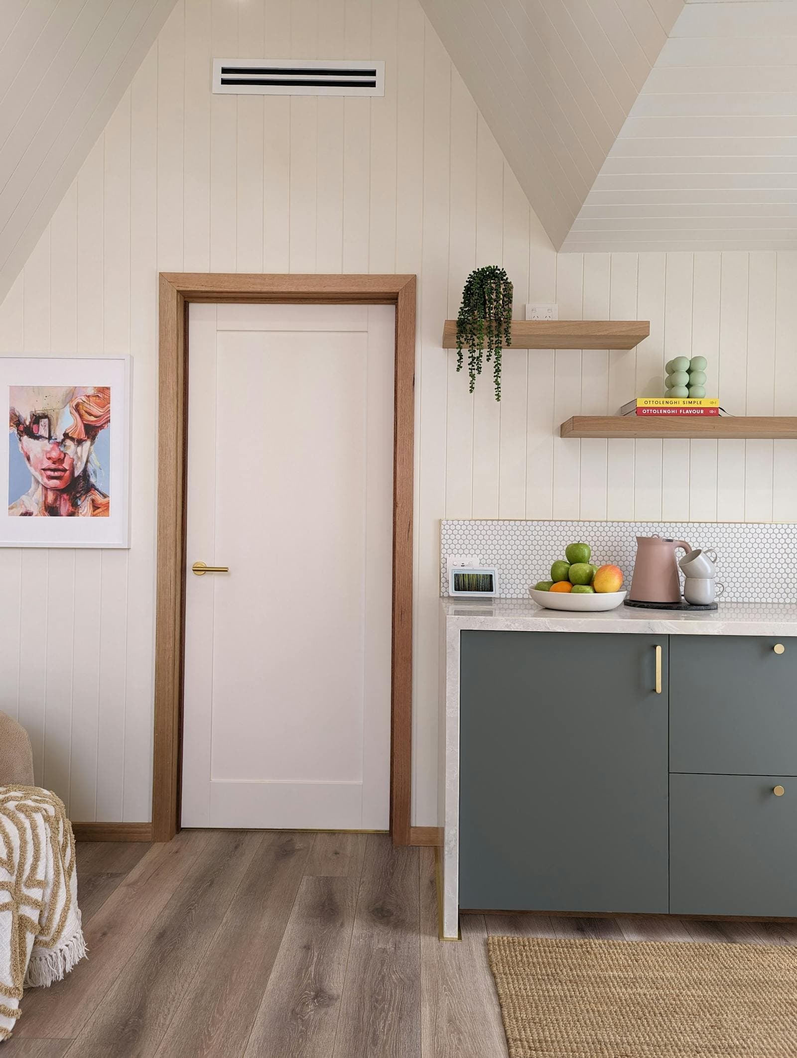 The kitchenette corner of the cabin, with the mini fridge under the bench