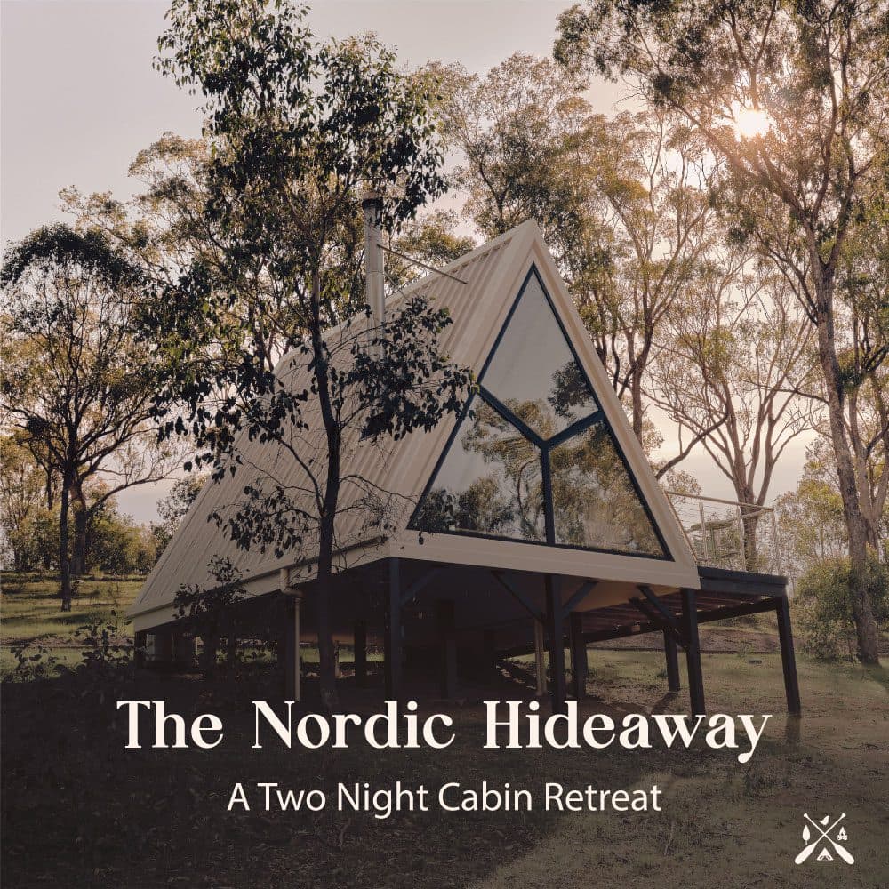 The Nordic Hideaway — the A-Frame cabin among the gums at sunset